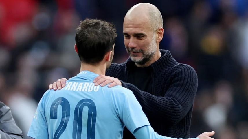Pep Guardiola celebrates with Bernardo Silva