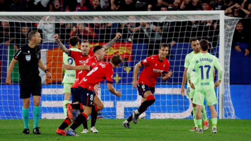 Osasuna's Abel Bretones celebrates with teammates 
