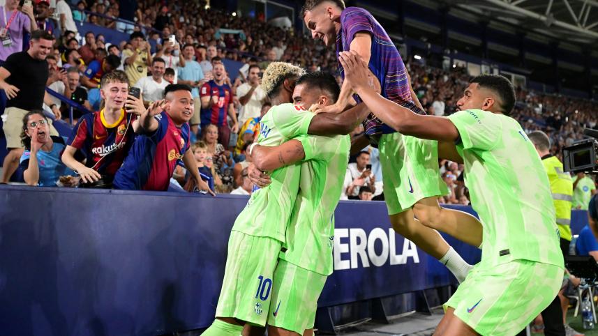 Barcelona's players celebrate with supporters