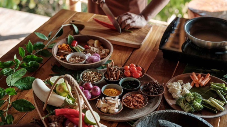 chef_teaching_cutting_red_chilli_fresh_ingredients