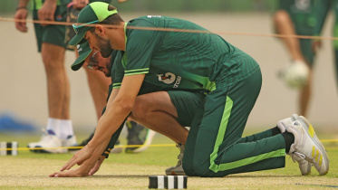 Pakistan captain Shaheen Afridi and coach Mike Hesson having a close look at the Mirpur pitch. Photo: Firoz Ahmed