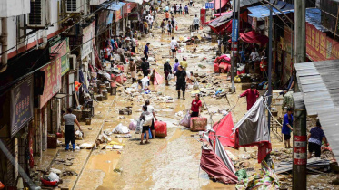 চীনের গুইঝৌ প্রদেশে বন্যায় রাস্তা প্লাবিত হয়েছে। ছবি: এএফপি
