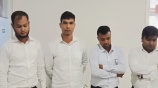 আটক চারজন। ছবি: ভিডিও থেকে নেওয়া